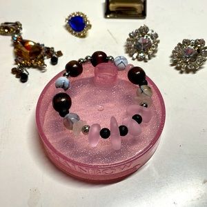 Cute pink faux sea glass bracelet size medium wrist on strong elastic.